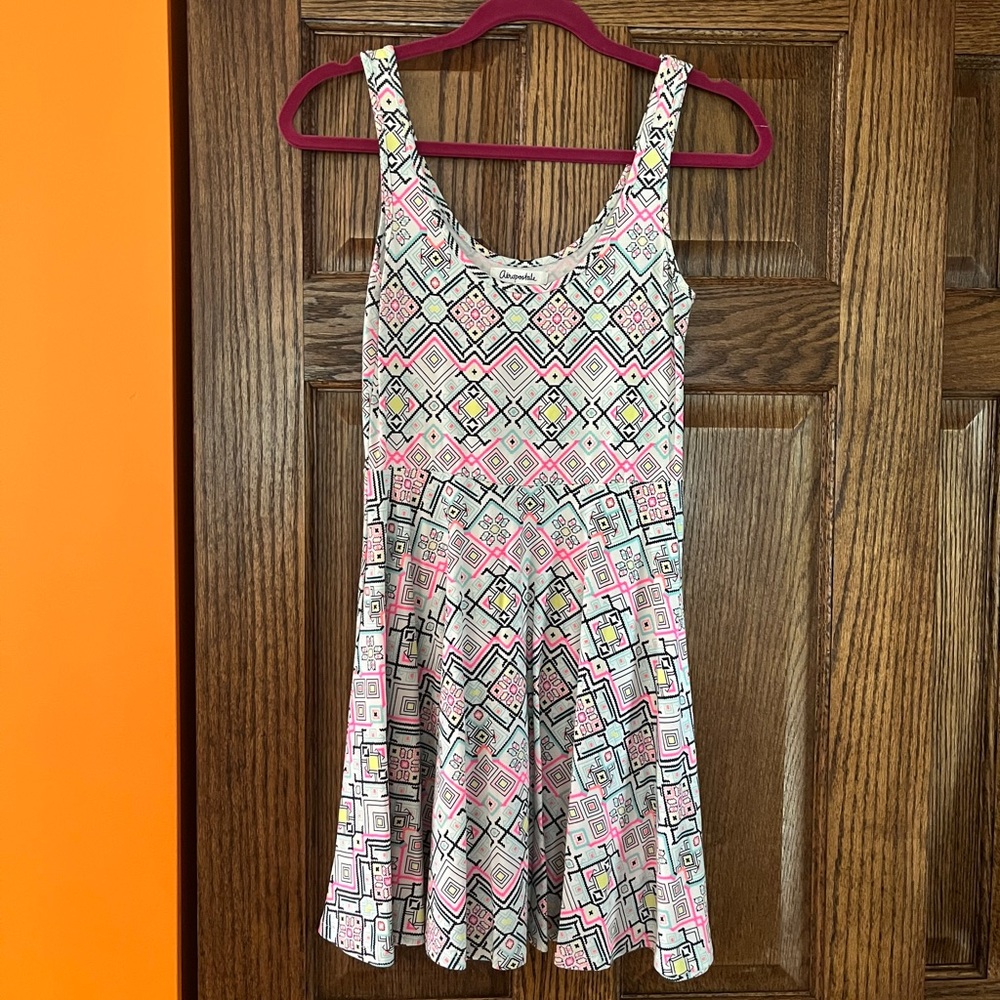 Patterned Aeropostale dress. Base is white with pops of pink, yellow, and black.